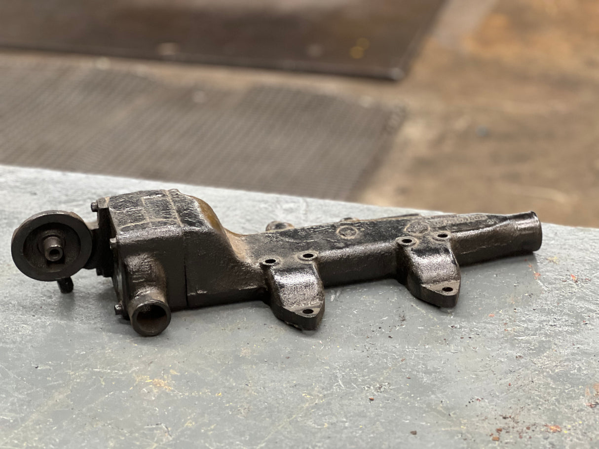 Mack E7 WATER MANIFOLD PART # 107GC550M, W/ OIL FILTER HEAD PART # 32GB354P