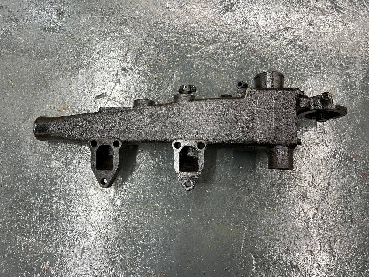 Mack E7 WATER MANIFOLD PART # 107GC550M, W/ OIL FILTER HEAD PART # 32GB354P