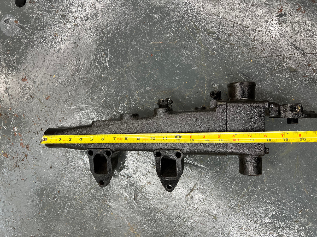 Mack E7 WATER MANIFOLD PART # 107GC550M, W/ OIL FILTER HEAD PART # 32GB354P